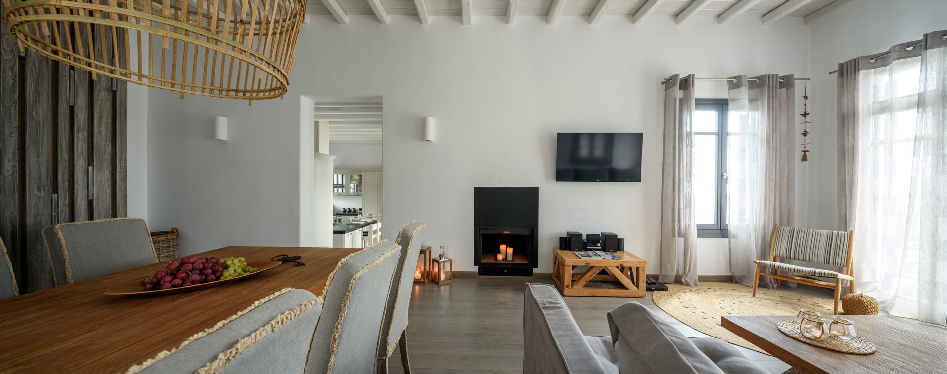 Living room with fireplace at Platinum Senior Villa in Kalafatis, Mykonos