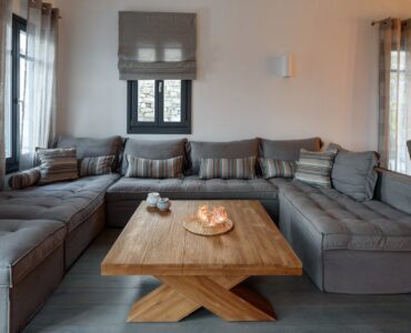 Lounge with large sofa at Platinum Senior Villa in Kalafatis, Mykonos