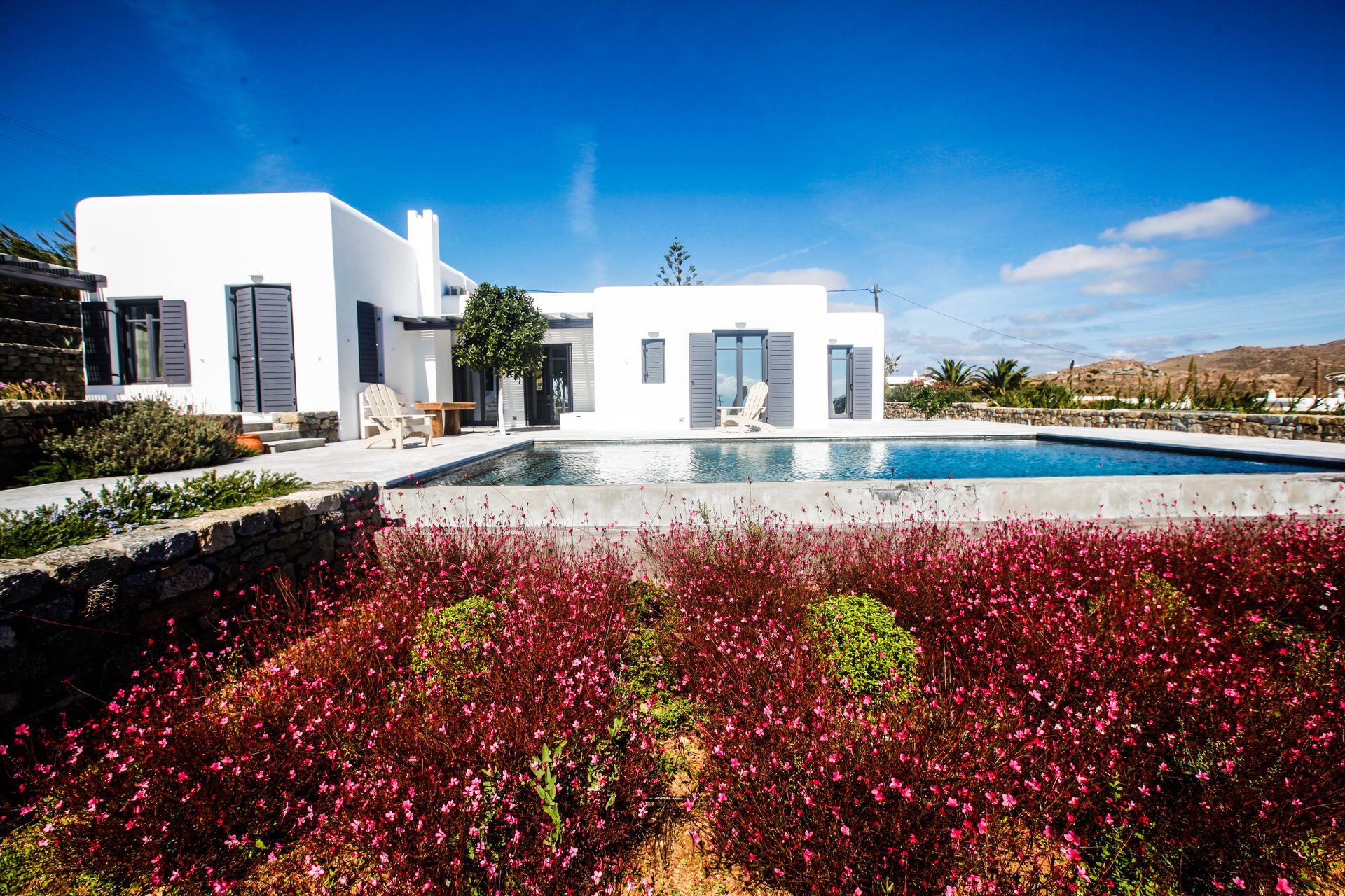 Villa and pool above the garden at Platinum Senior Villa in Kalafatis, Mykonos