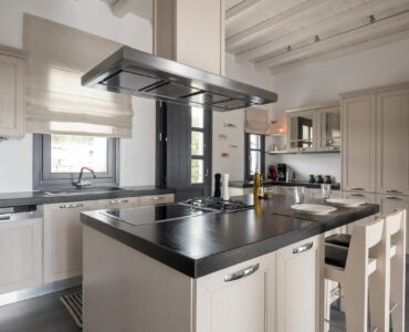 Kitchen with island at Platinum Senior Villa in Kalafatis, Mykonos