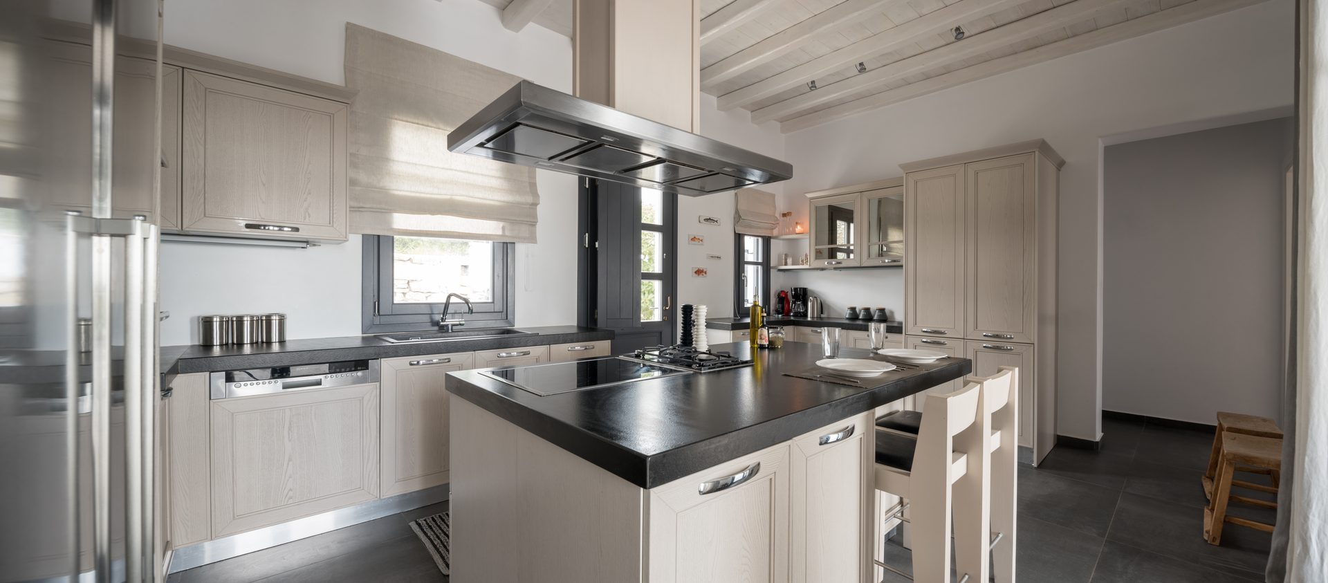 Kitchen with island at Platinum Senior Villa in Kalafatis, Mykonos
