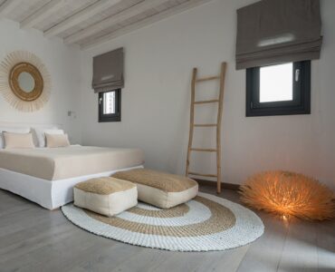 Bedroom with ladder shelf at Platinum Senior Villa in Kalafatis, Mykonos