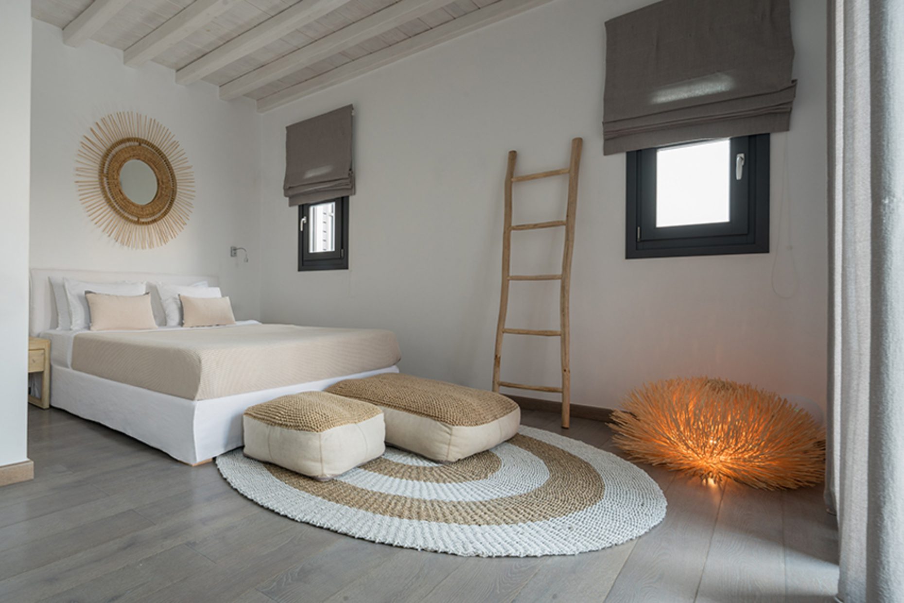 Bedroom with ladder shelf at Platinum Senior Villa in Kalafatis, Mykonos