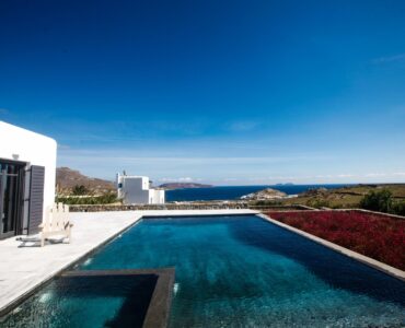 Pool and whitewashed villa at Platinum Senior Villa in Kalafatis, Mykonos