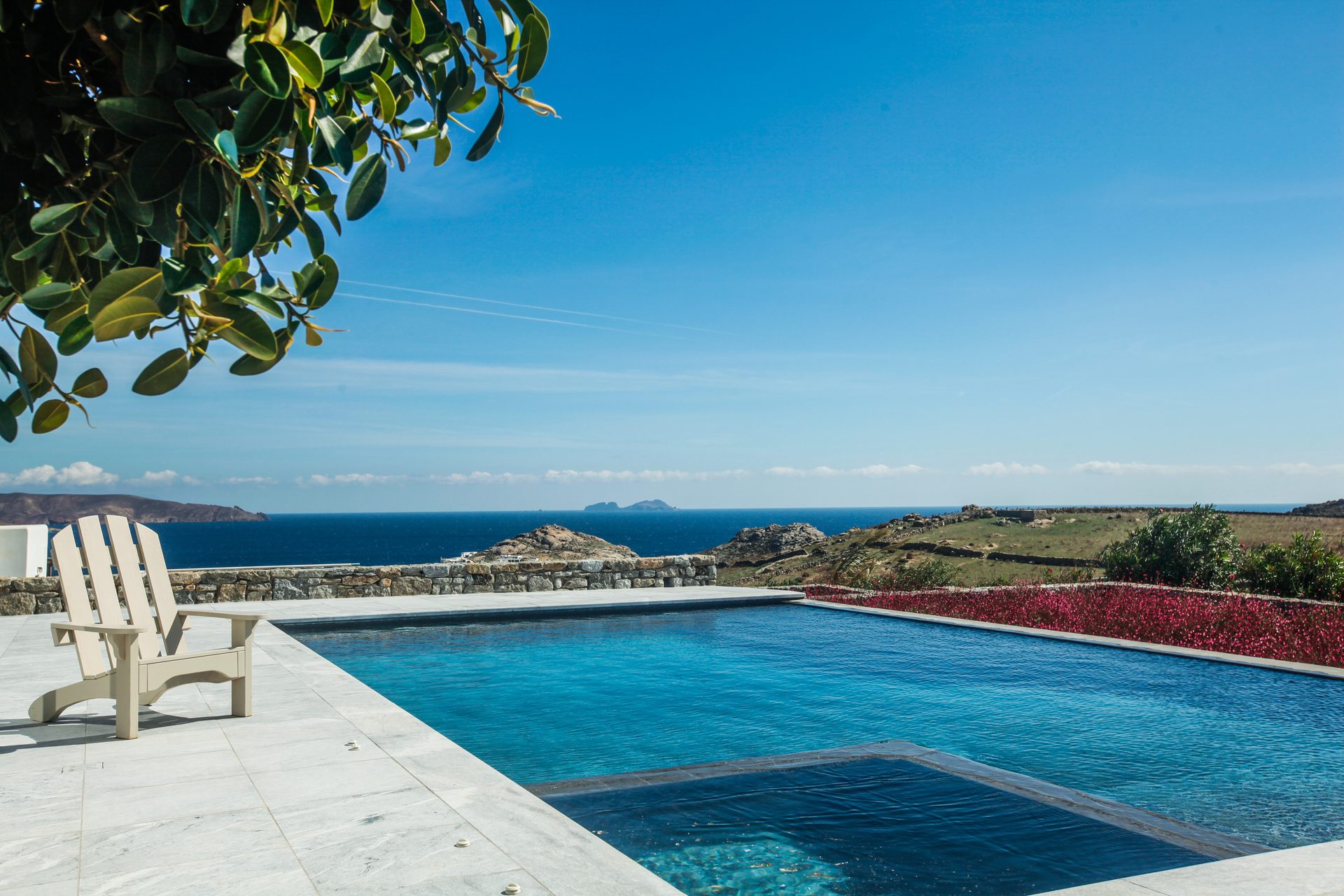 Pool with sea view and loungers at Platinum Senior Villa in Kalafatis, Mykonos