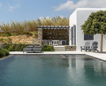 Pool and villa with olive tree at Platinum Senior Villa in Kalafatis, Mykonos