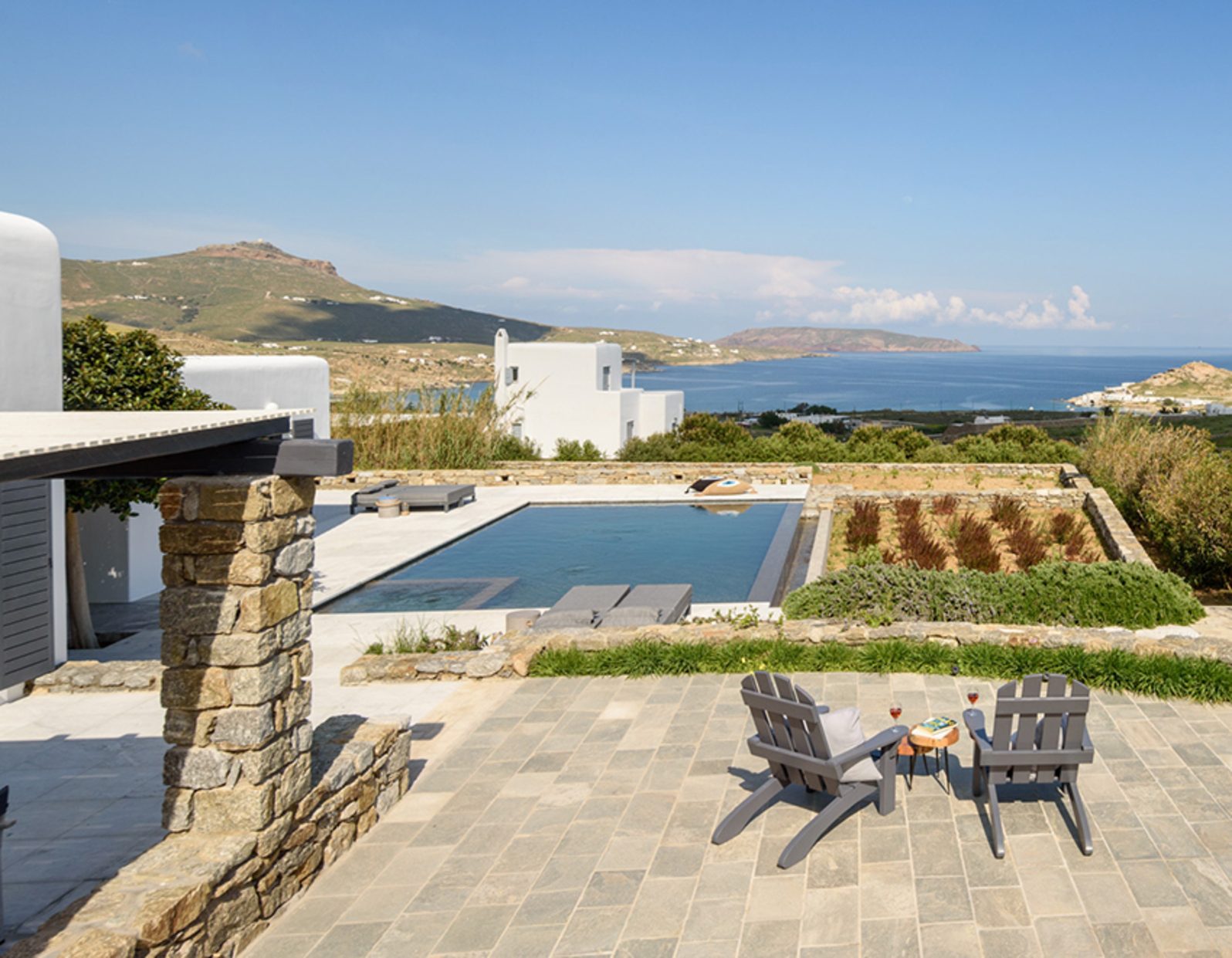 Pool terrace with countryside and sea view at Platinum Senior Villa in Kalafatis, Mykonos