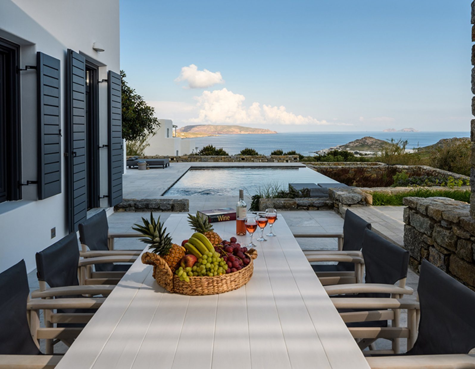 Outdoor dining table with sea view at Platinum Senior Villa in Kalafatis, Mykonos