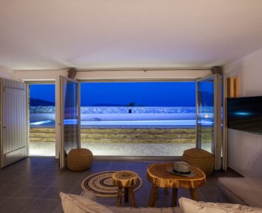 Living room opening to the sea view at Platinum Superior Villa in Kalafatis, Mykonos