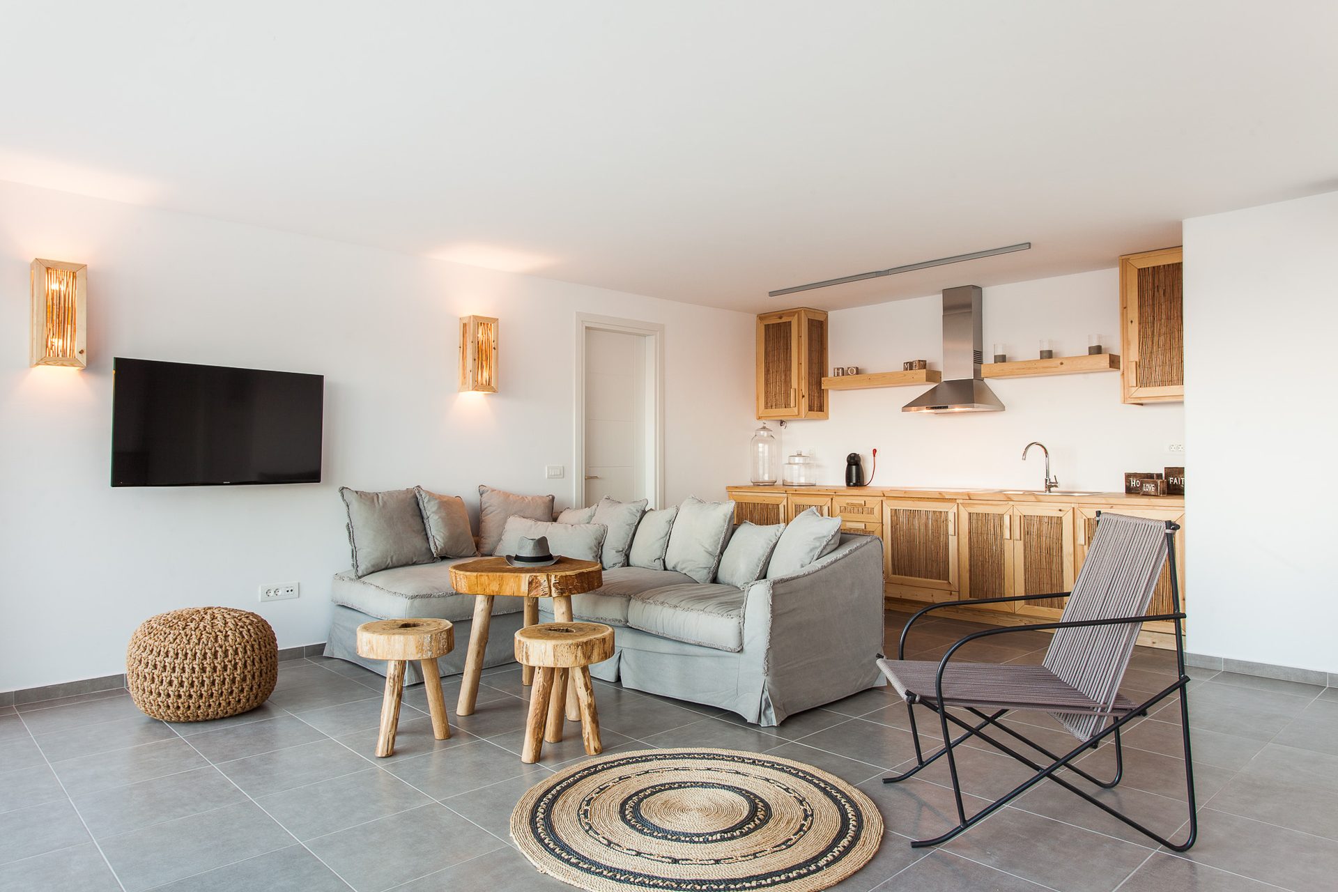 Living room with TV at Platinum Superior Villa in Kalafatis, Mykonos