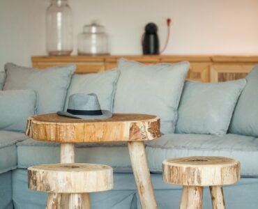 Lounge with wooden stools at Platinum Superior Villa in Kalafatis, Mykonos