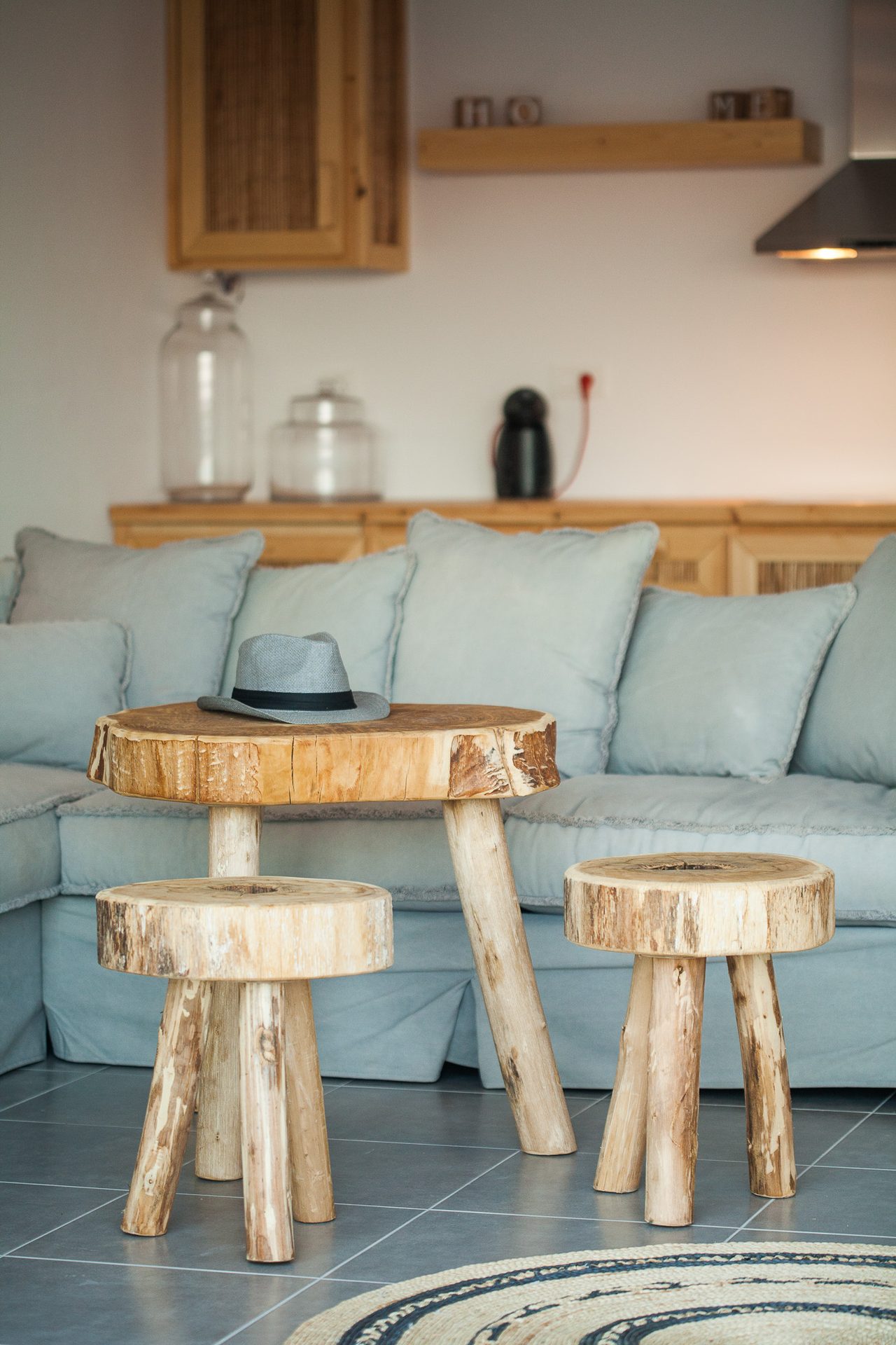 Lounge with wooden stools at Platinum Superior Villa in Kalafatis, Mykonos