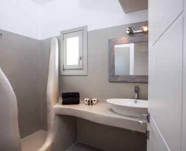 Bathroom with stone basin at Platinum Superior Villa in Kalafatis, Mykonos