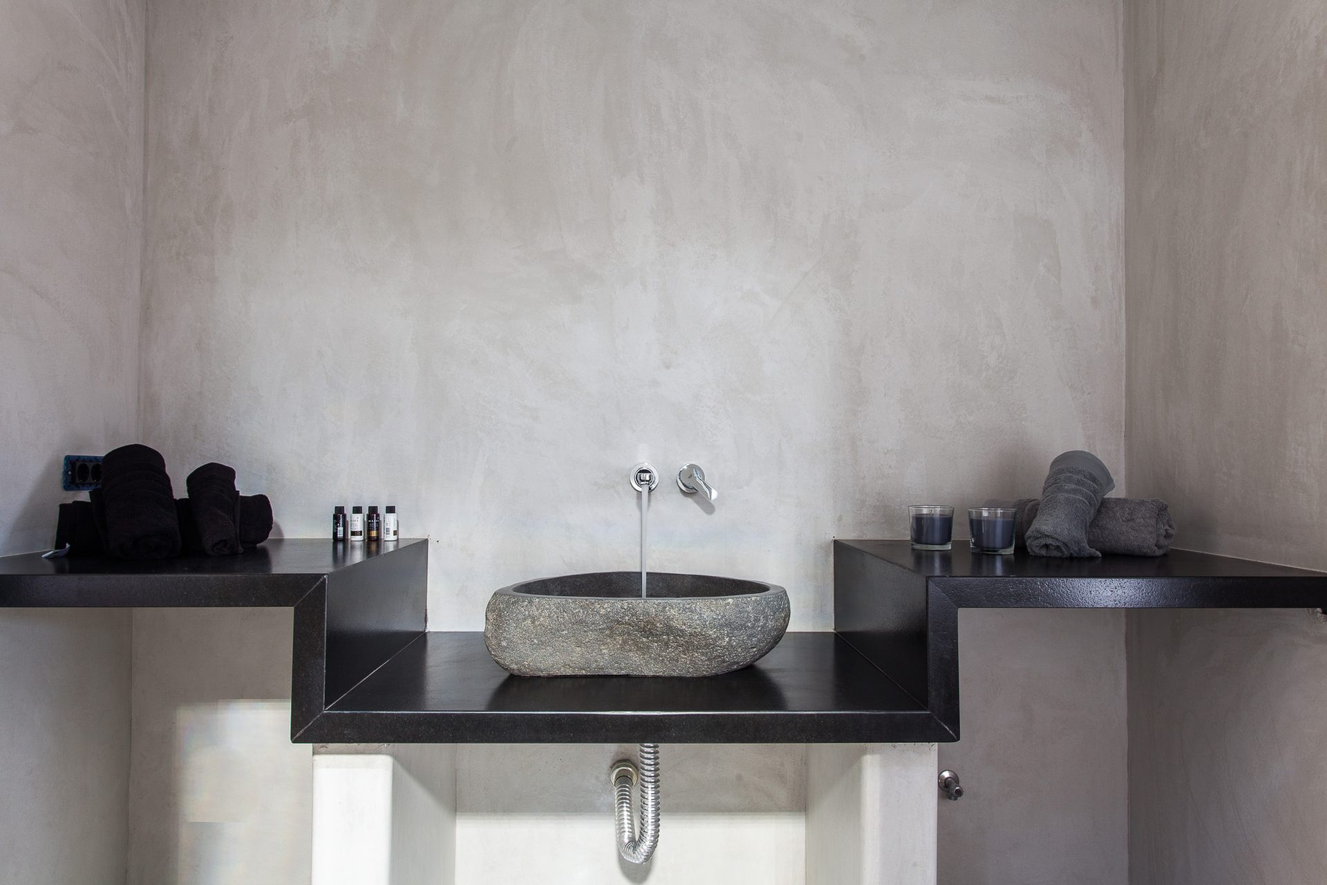 Bathroom with stone basin at Platinum Superior Villa in Kalafatis, Mykonos