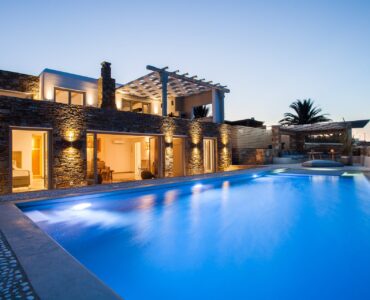Pool lit at dusk at Platinum Superior Villa in Kalafatis, Mykonos