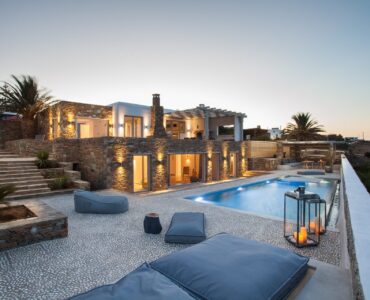 Terrace and pool at dusk at Platinum Superior Villa in Kalafatis, Mykonos