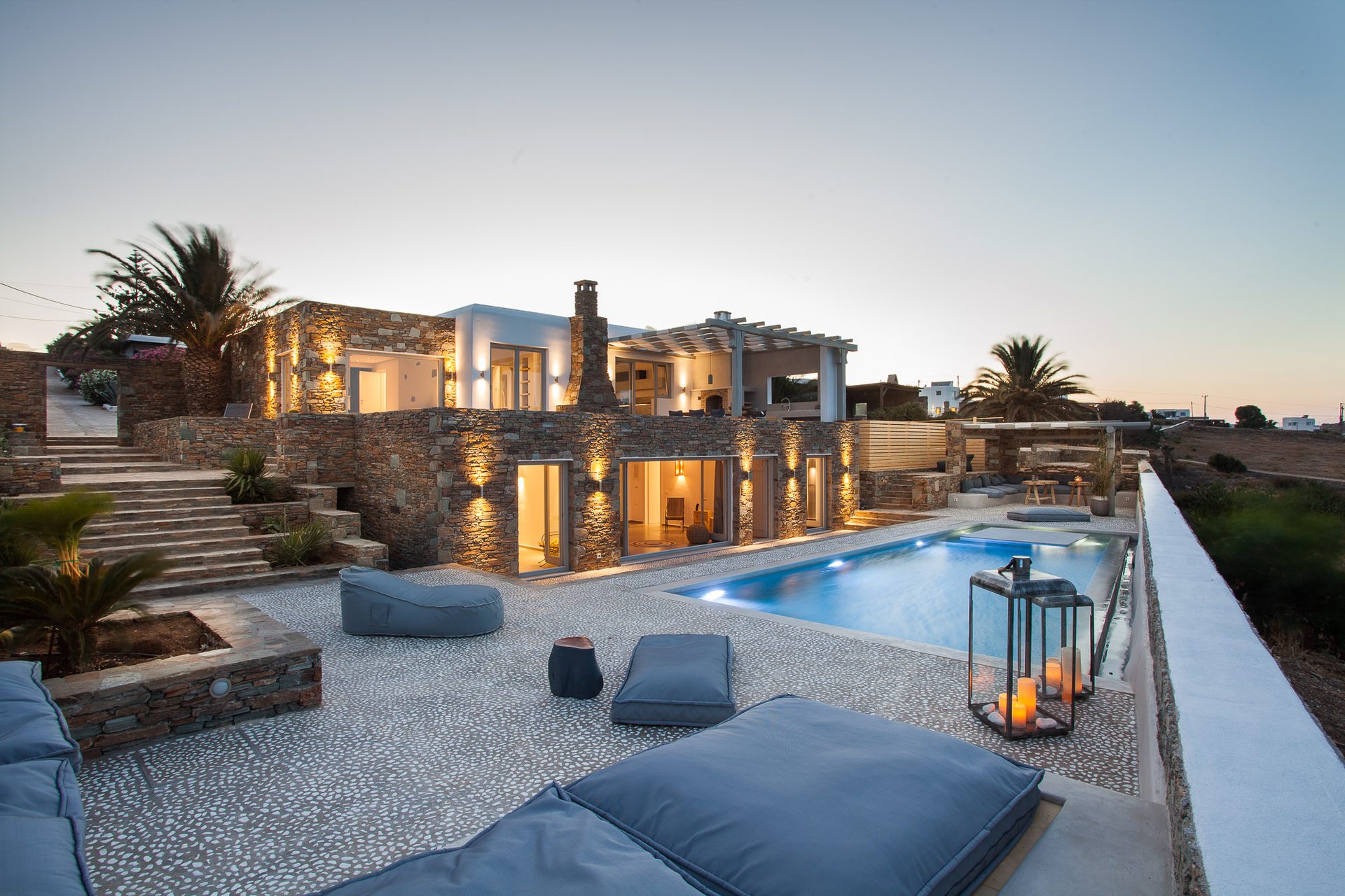 Terrace and pool at dusk at Platinum Superior Villa in Kalafatis, Mykonos