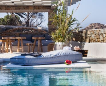 Pool with lounge area at Platinum Superior Villa in Kalafatis, Mykonos