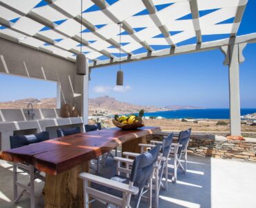 Outdoor dining with sea view at Platinum Superior Villa in Kalafatis, Mykonos