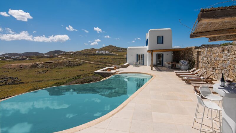 Free-form pool with sea and hill views at Tranquil Villa 5 in Kalafatis, Mykonos