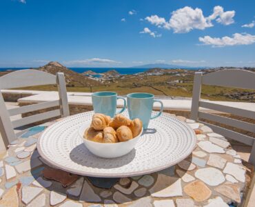 Terrace table with sea view at Tranquil Villa 5 in Kalafatis, Mykonos