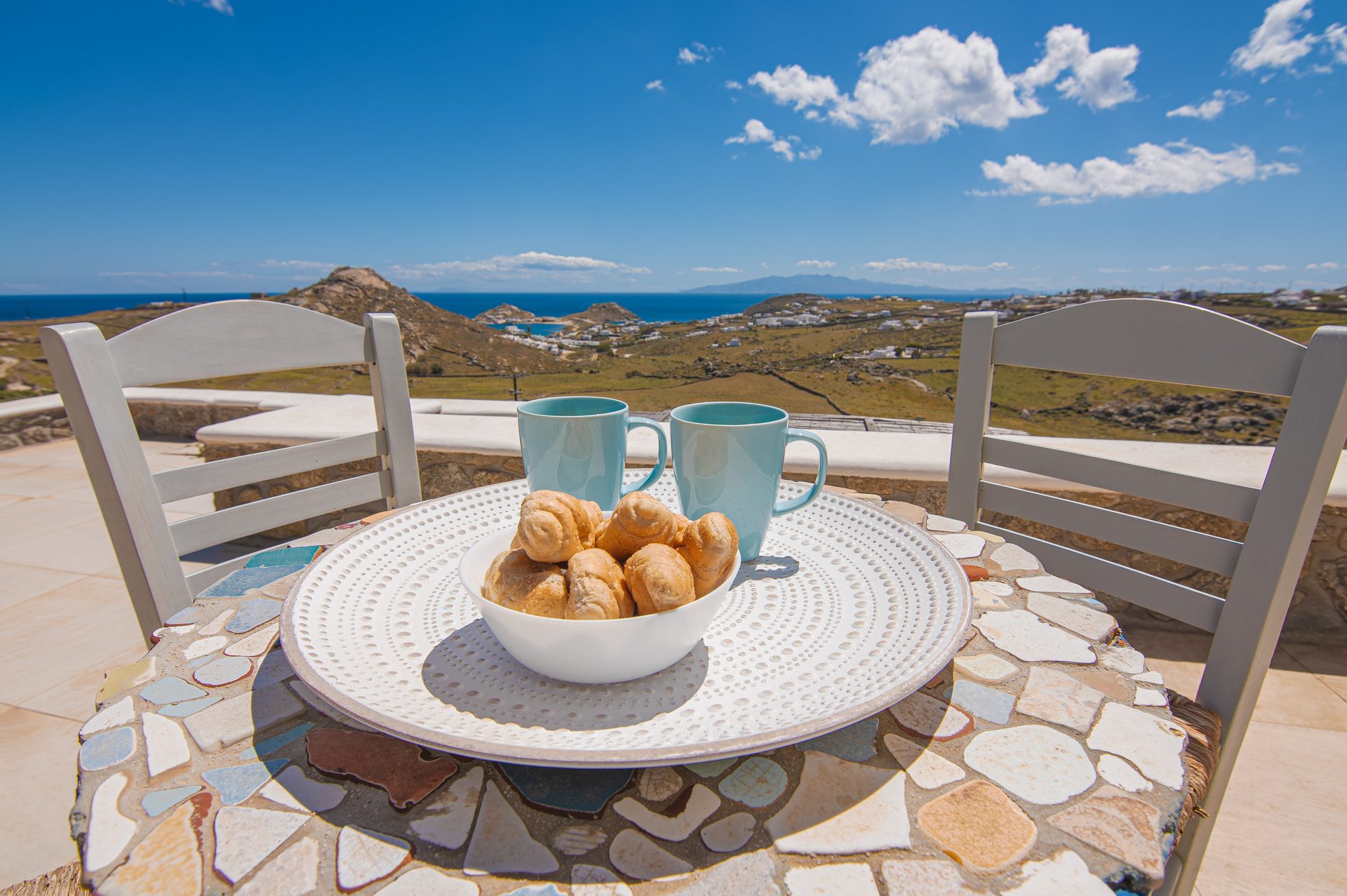 Terrace table with sea view at Tranquil Villa 5 in Kalafatis, Mykonos