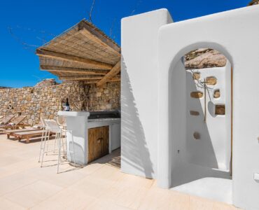 Whitewashed arch and pergola on the terrace at Tranquil Villa 5 in Kalafatis, Mykonos