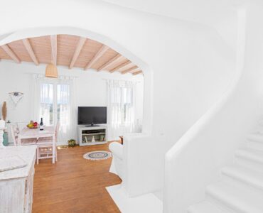 Living room with arched opening at Tranquil Villa 5 in Kalafatis, Mykonos