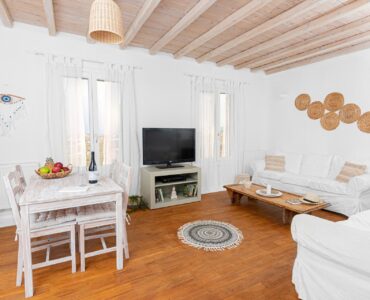 Open-plan living and dining area at Tranquil Villa 5 in Kalafatis, Mykonos