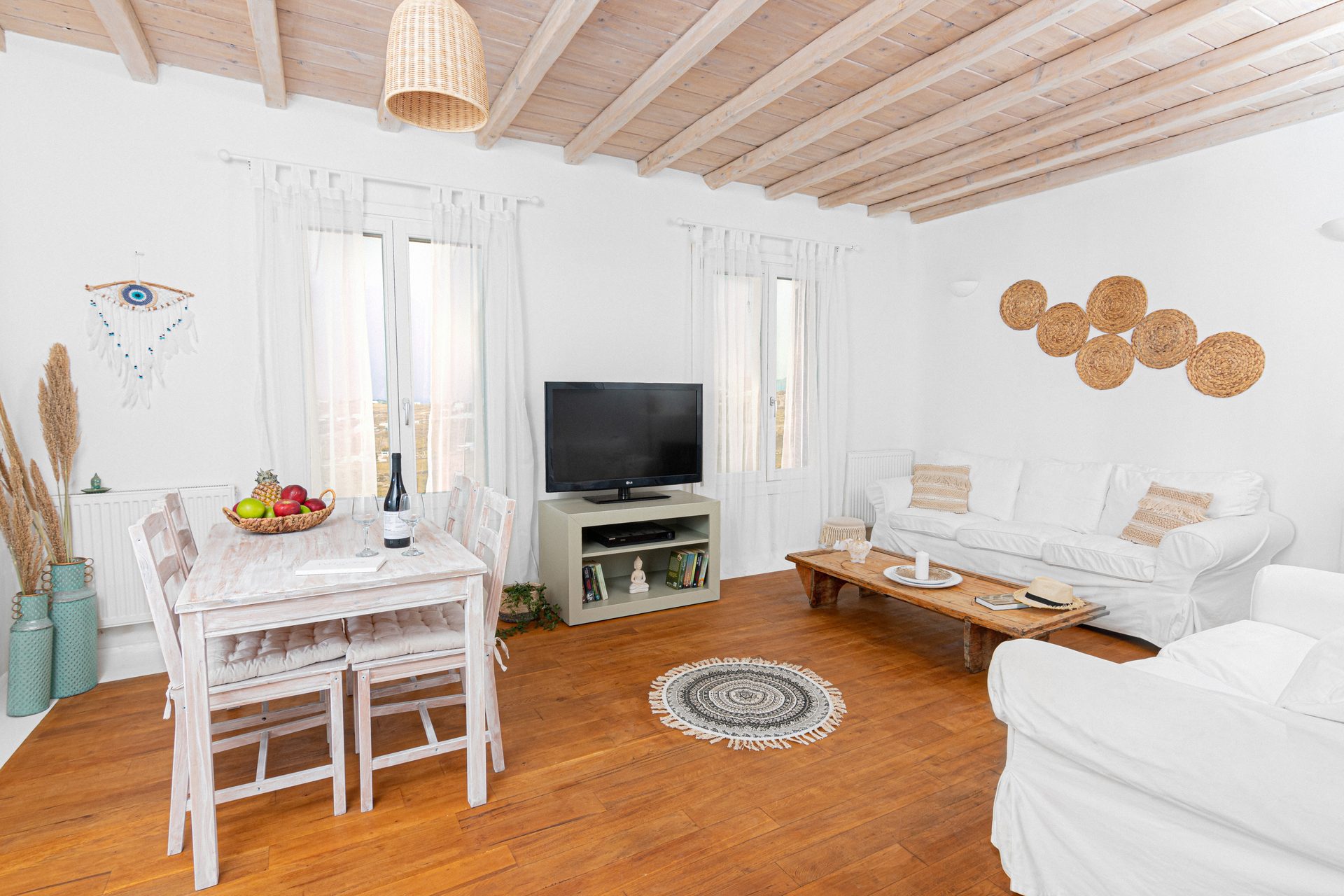 Open-plan living and dining area at Tranquil Villa 5 in Kalafatis, Mykonos