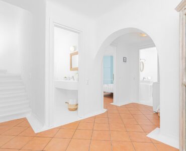 Arched hallway and staircase at Tranquil Villa 5 in Kalafatis, Mykonos