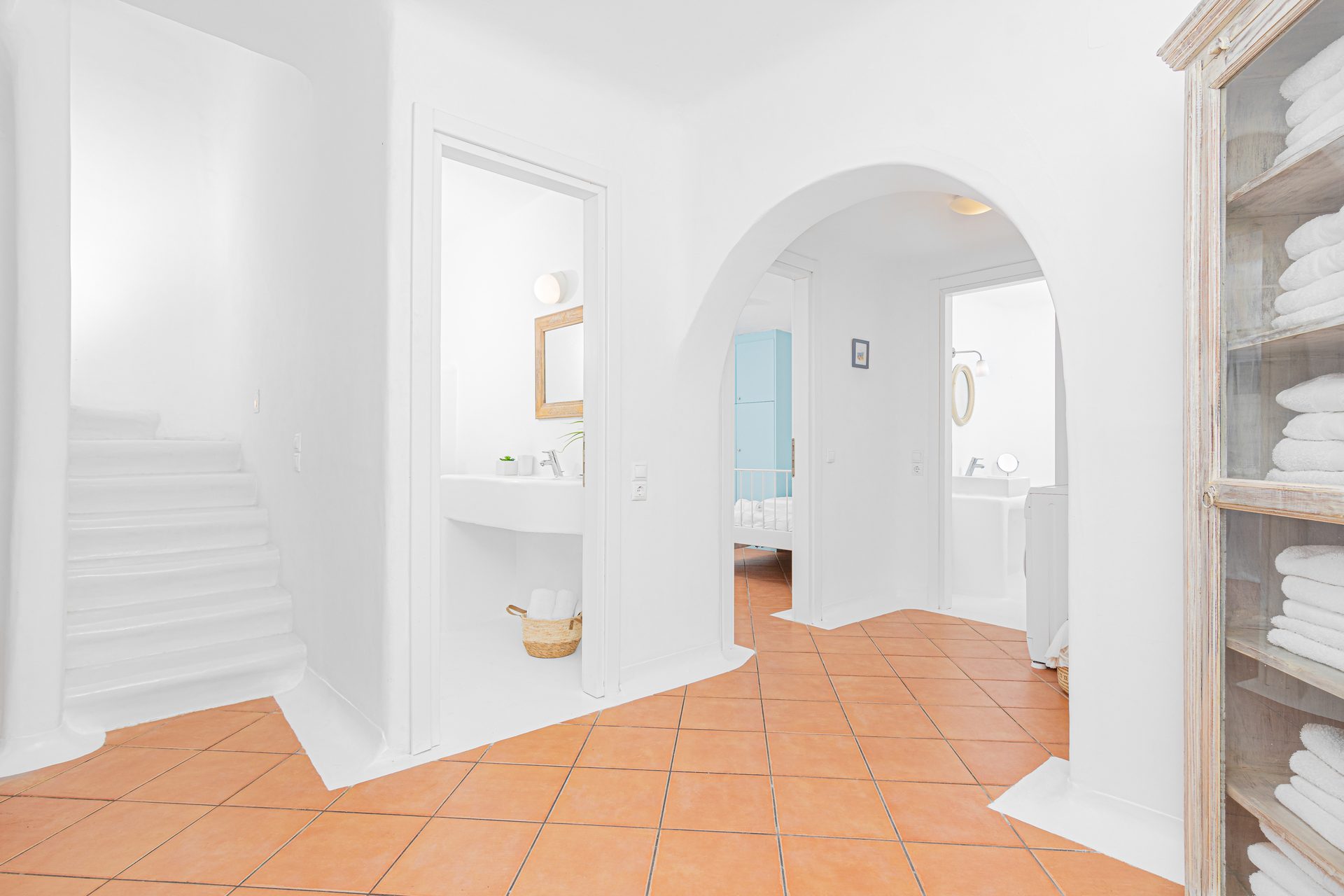 Arched hallway and staircase at Tranquil Villa 5 in Kalafatis, Mykonos