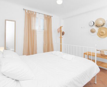 Double bedroom with sitting corner at Tranquil Villa 5 in Kalafatis, Mykonos