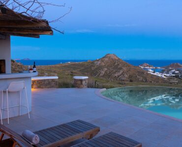 Pool terrace at dusk at Tranquil Villa 5 in Kalafatis, Mykonos