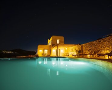 Villa and pool at night at Tranquil Villa 5 in Kalafatis, Mykonos