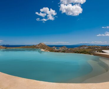 Pool and the coastline at Tranquil Villa 5 in Kalafatis, Mykonos