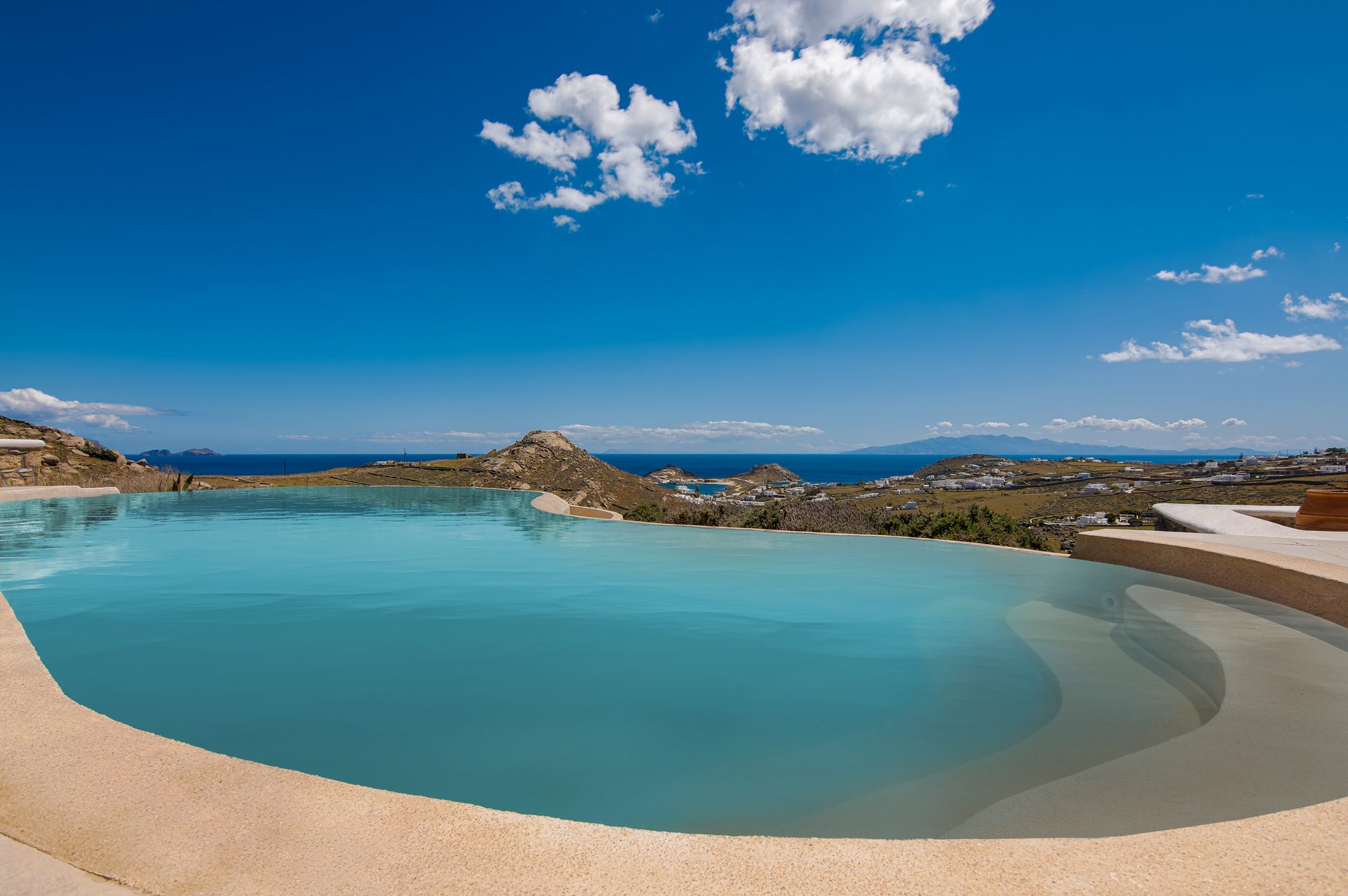 Pool and the coastline at Tranquil Villa 5 in Kalafatis, Mykonos