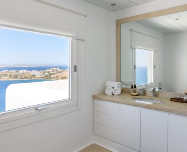 Bathroom with sea-view window at Villa Alkioni in Agios Lazaros, Mykonos