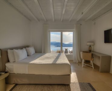 Bedroom with sea view and desk at Villa Alkioni in Agios Lazaros, Mykonos