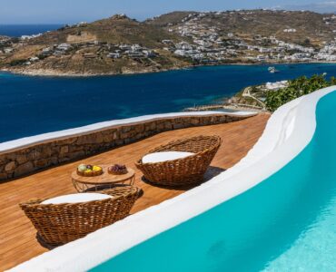 Infinity pool curving along the terrace at Villa Alkioni in Agios Lazaros, Mykonos