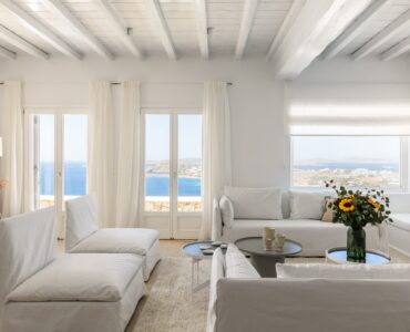 Living room with white sofas at Villa Alkioni in Agios Lazaros, Mykonos