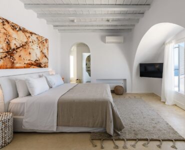 Master bedroom with king-size bed at Villa Alkioni in Agios Lazaros, Mykonos