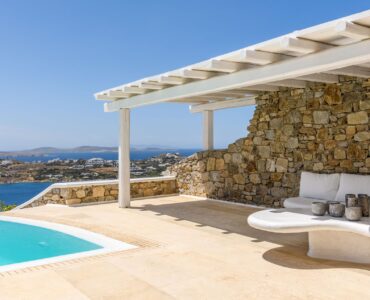Pergola-covered lounge by the pool at Villa Alkioni in Agios Lazaros, Mykonos
