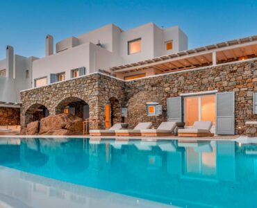 Pool and stone arches of the villa at Villa Alkioni in Agios Lazaros, Mykonos