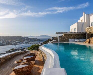 Pool terrace with Mykonos Town view at Villa Alkioni in Agios Lazaros, Mykonos