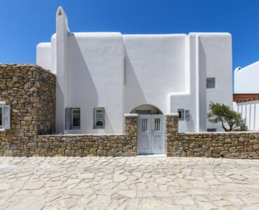 Whitewashed exterior and stone walls at Villa Alkioni in Agios Lazaros, Mykonos