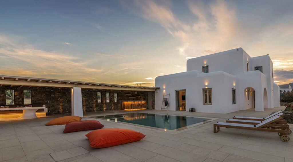Private pool terrace at sunset at Villa Aloni in Ftelia, Mykonos