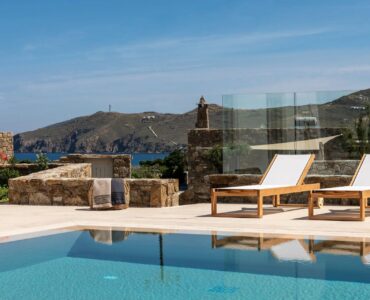 Pool with sun loungers and countryside views at Villa Aloni in Ftelia, Mykonos