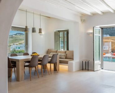 Open-plan dining area with pool views at Villa Aloni in Ftelia, Mykonos