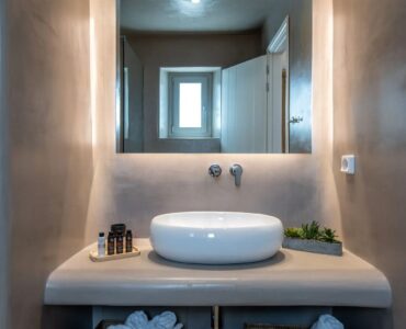Bathroom vanity with stone basin at Villa Aloni in Ftelia, Mykonos